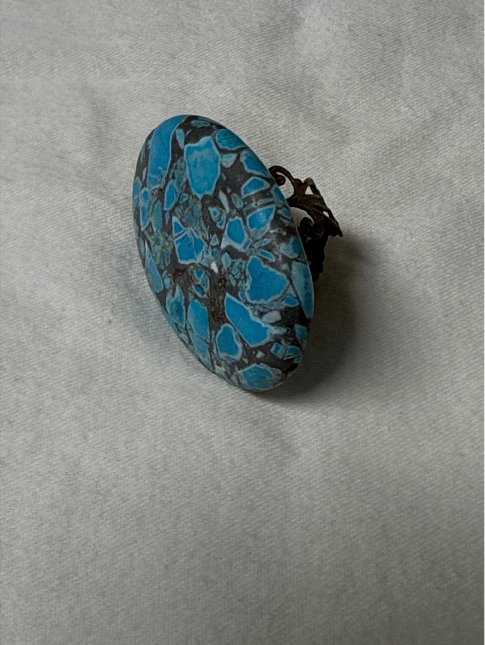 Vintage Blue and Black Oval Stone Ring with Ornate Bronze Band